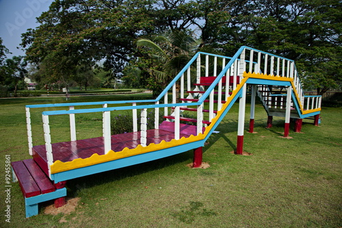 Colorful wooden bridge in playground photo
