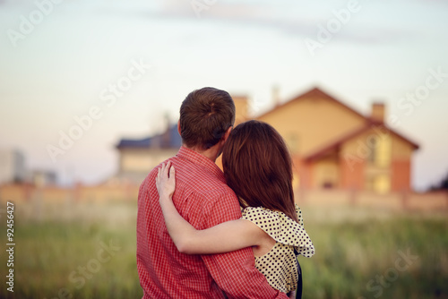 loving couple looking at their home