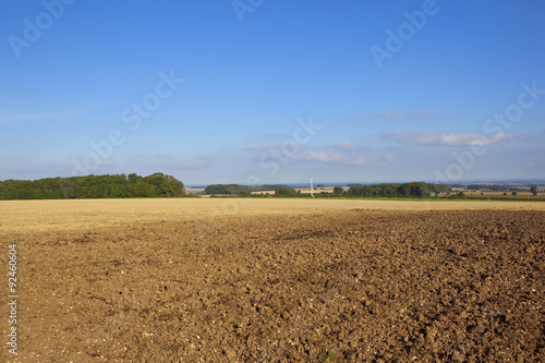 plowed field with wind turbine