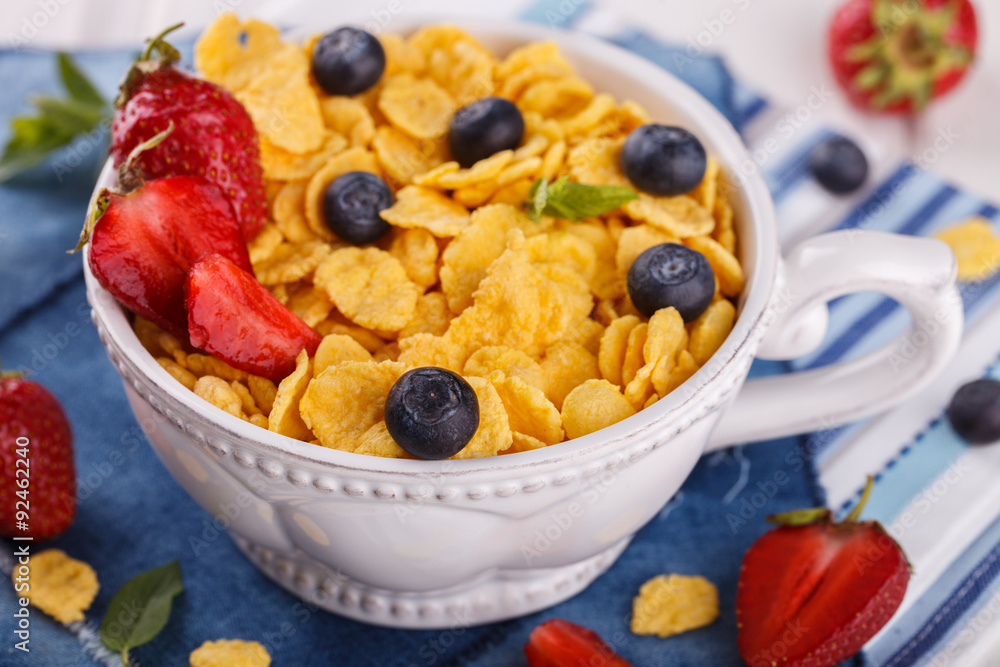 Corn flakes and fresh berries, for Breakfast. selective focus Corn flakes and fresh berries, for Breakfast. selective focus