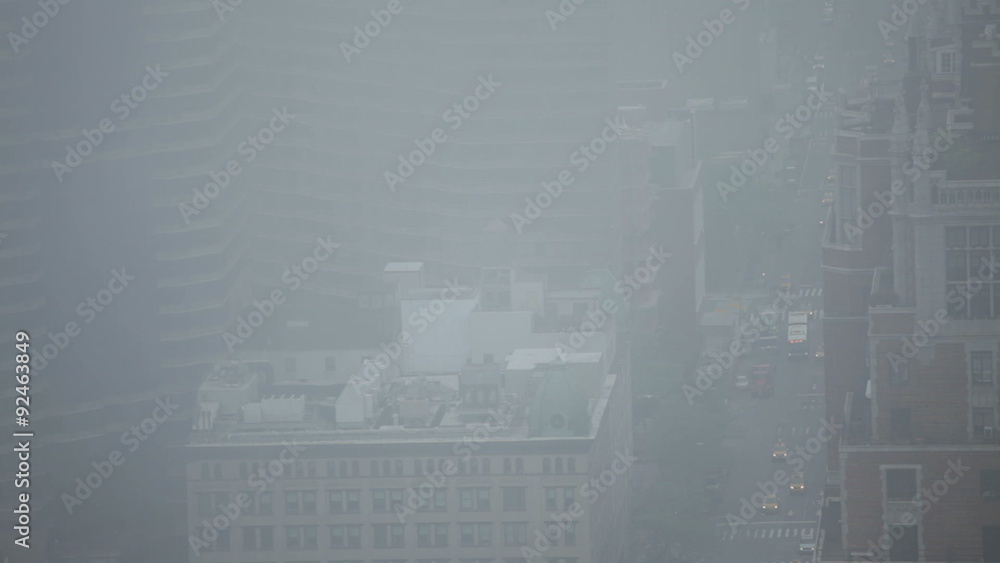 Fast motion detail of traffic during foggy day at First Avenue in Midtown Manhattan, New York City, USA. Fast motion detail of traffic during foggy day at First Avenue in Midtown Manhattan, New York City, USA.