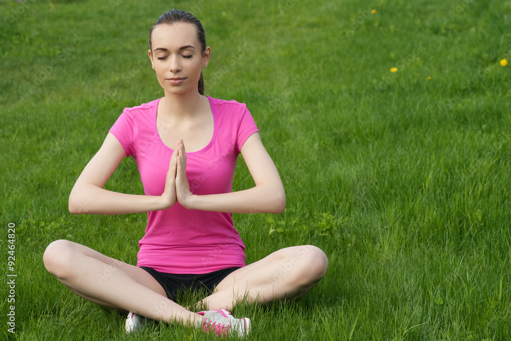Young girl doing yoga in the park Young girl doing yoga in the park