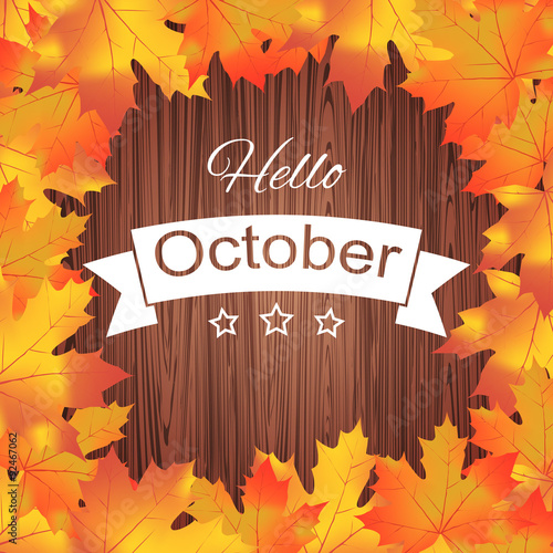 Hello October. Bright colourful autumn leaves on wood background