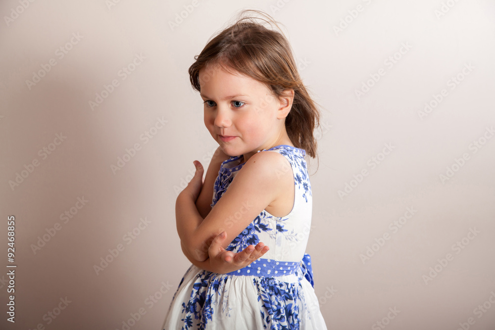 Little girl with hands crossed in front of her Little girl with hands crossed in front of her