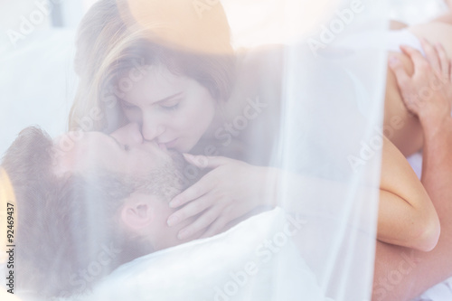 Couple kissing in sexual position