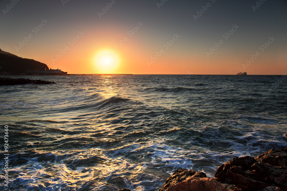 Fototapeta premium Sunset over boats and see