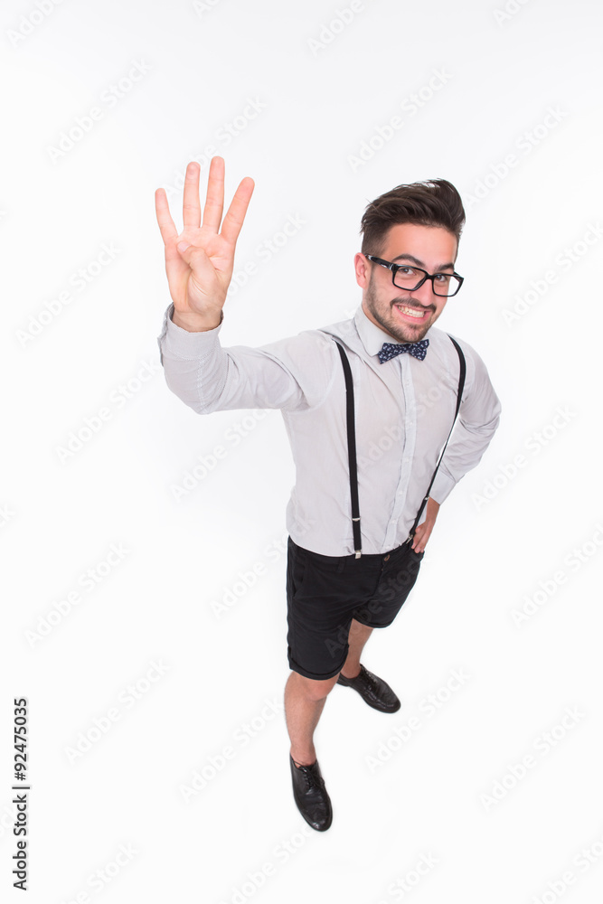 Handsome man showing four fingers in studio Handsome man showing four fingers in studio