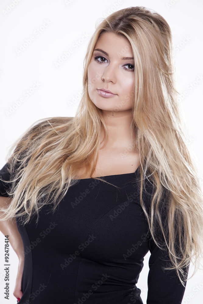Young slim sexy woman in black dress isolated on white backgroun Young slim sexy woman in black dress isolated on white backgroun