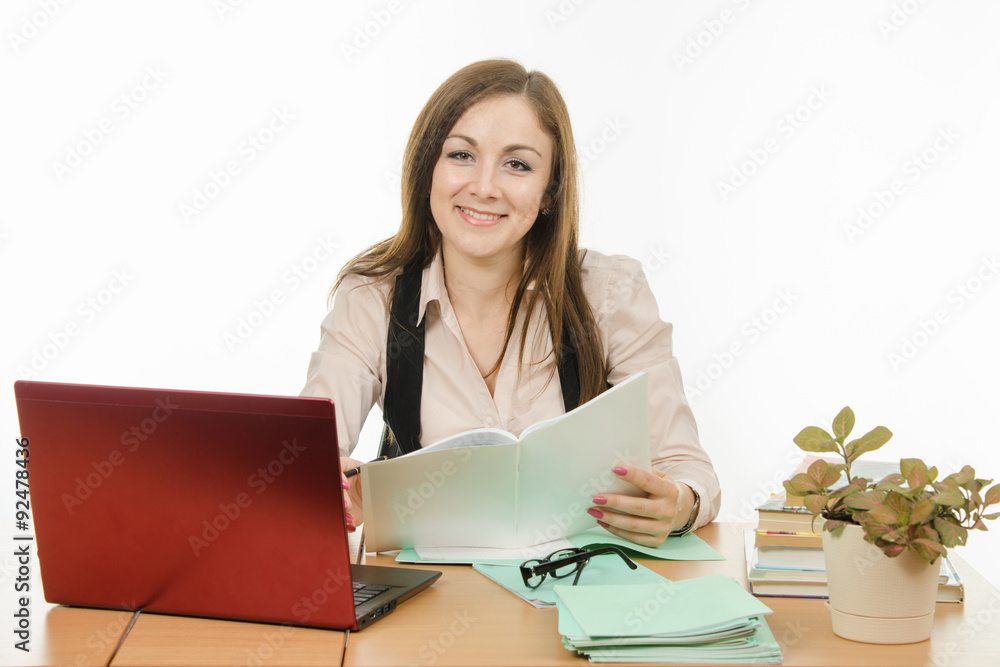 Portrait of a smiling teacher at your desk Portrait of a smiling teacher at your desk