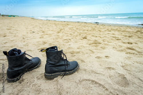 pair of boots at beach