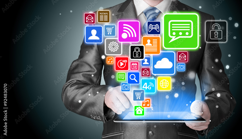 Business man using tablet PC with social media icon set Business man using tablet PC with social media icon set