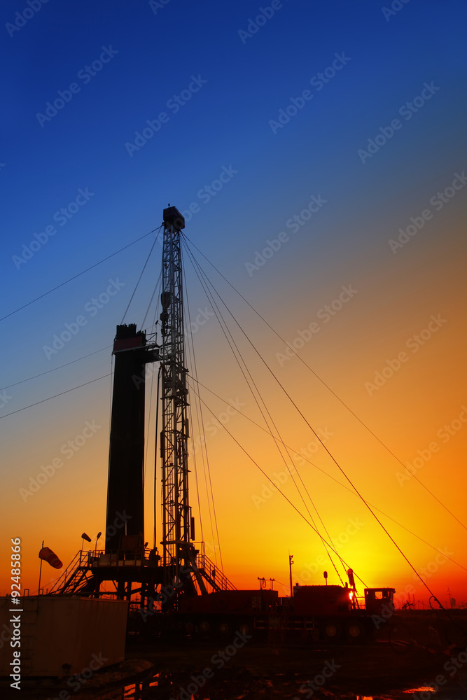 In the evening, the silhouette of oilfield derrick
