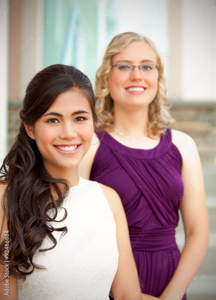 Beautiful biracial young bride smiling with her multiethnic grou Beautiful biracial young bride smiling with her multiethnic grou