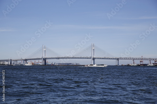 The Yokohama Bay Bridge with a water taxi in Yokohama, Japan