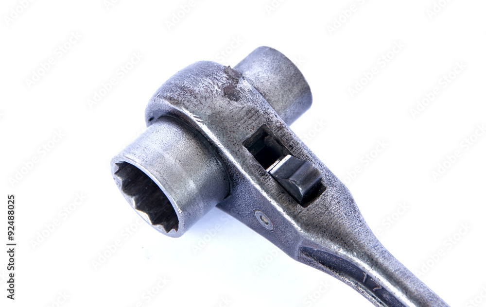 A ratcheting socket wrench, with a shallow depth of field. A ratcheting socket wrench, with a shallow depth of field.