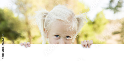 Cute Little Girl Holding Wh...