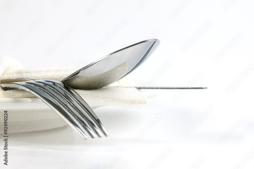 close up dinning silverware fork , spoon and knife with dish on close up dinning silverware fork , spoon and knife with dish on