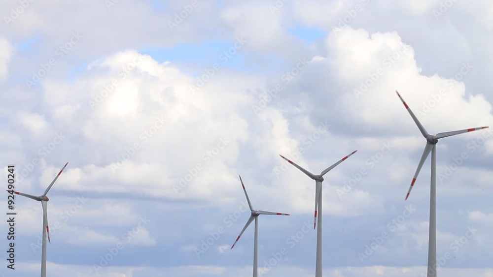 wind turbines against cloudy blue sky, wind wheels
wind turbines against cloudy blue sky, wind wheels