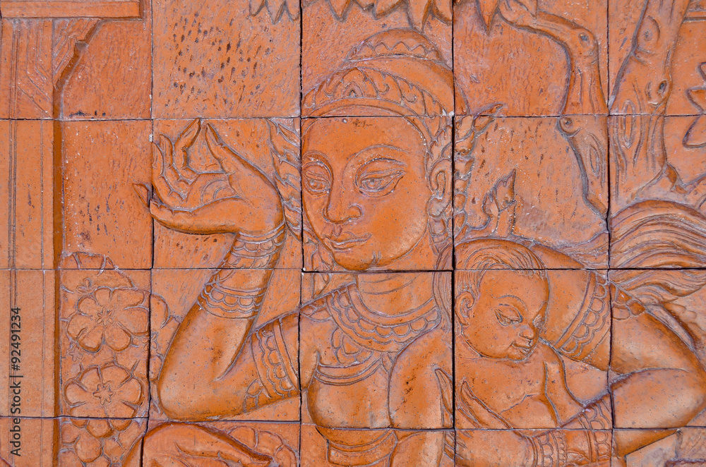 Art Thai style carving Buddha on the wall in temple,Thailand. Ge