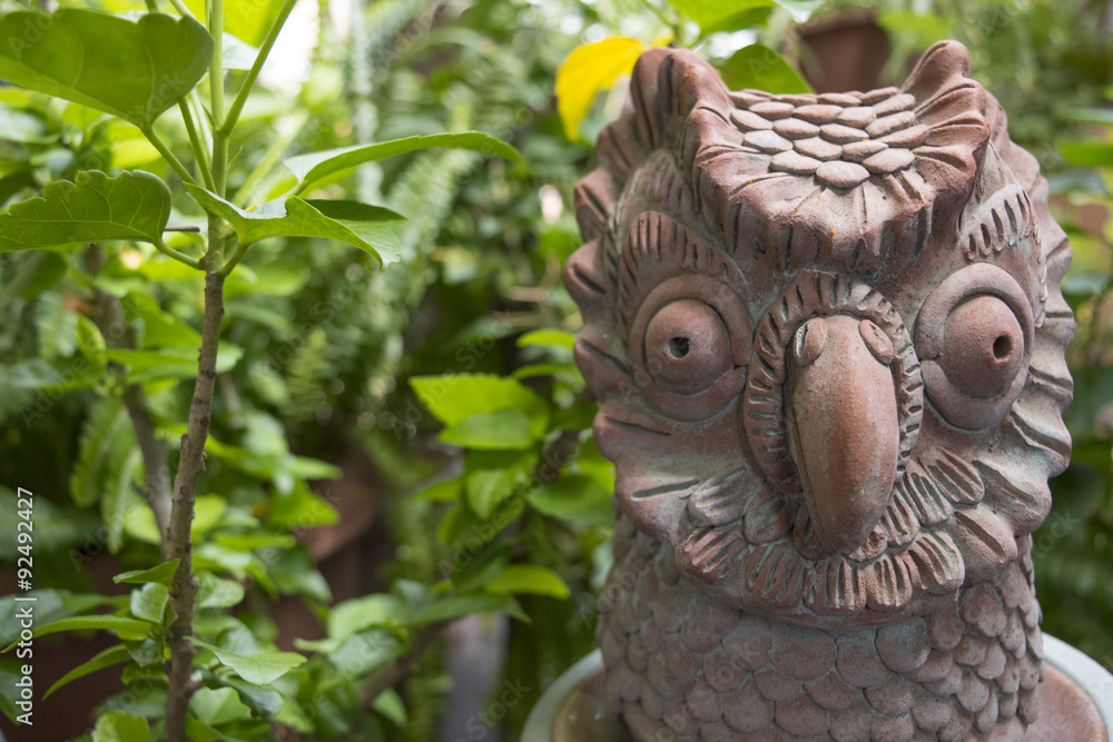 A terracotta owl garden accessories A terracotta owl garden accessories