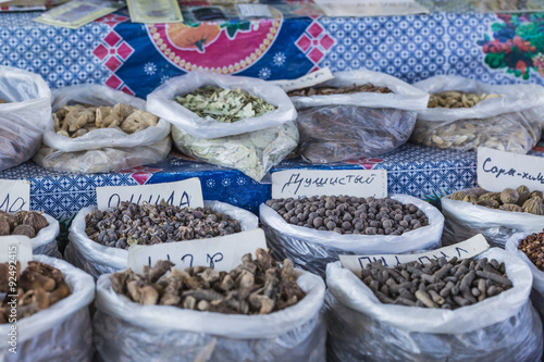 Beautiful vivid oriental market with bags full of various spices photo