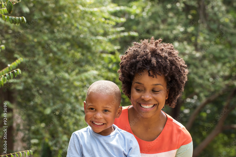 African American mother holding her son. African American mother holding her son.