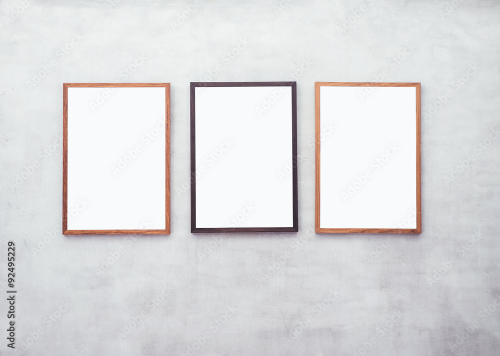Mock up Blank Poster with Wooden frame on Cement wall Mock up Blank Poster with Wooden frame on Cement wall
