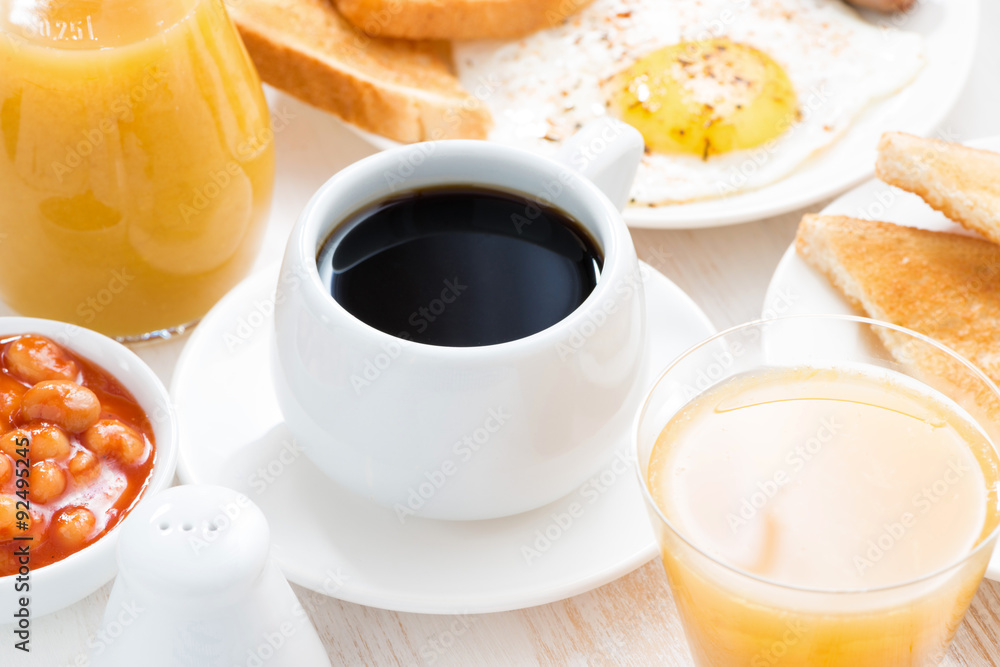 traditional breakfast - coffee, juice, eggs, toast on table traditional breakfast - coffee, juice, eggs, toast on table