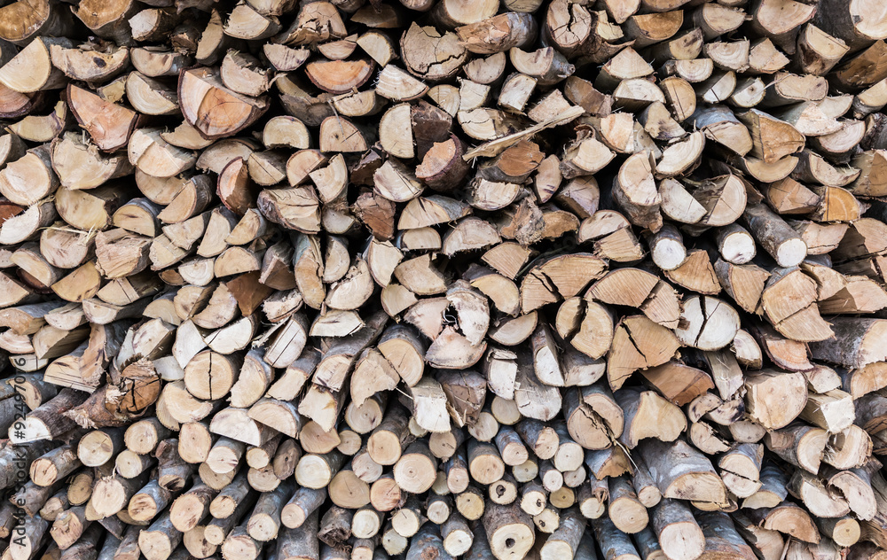 Stack of firewood, wood background texture. Layer of stored cut Stack of firewood, wood background texture. Layer of stored cut