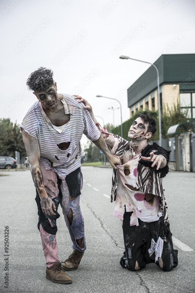 Fototapeta premium Two male zombies standing in empty city street