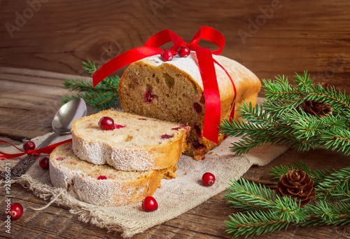 Christmas cake with cranberry on an old wooden background