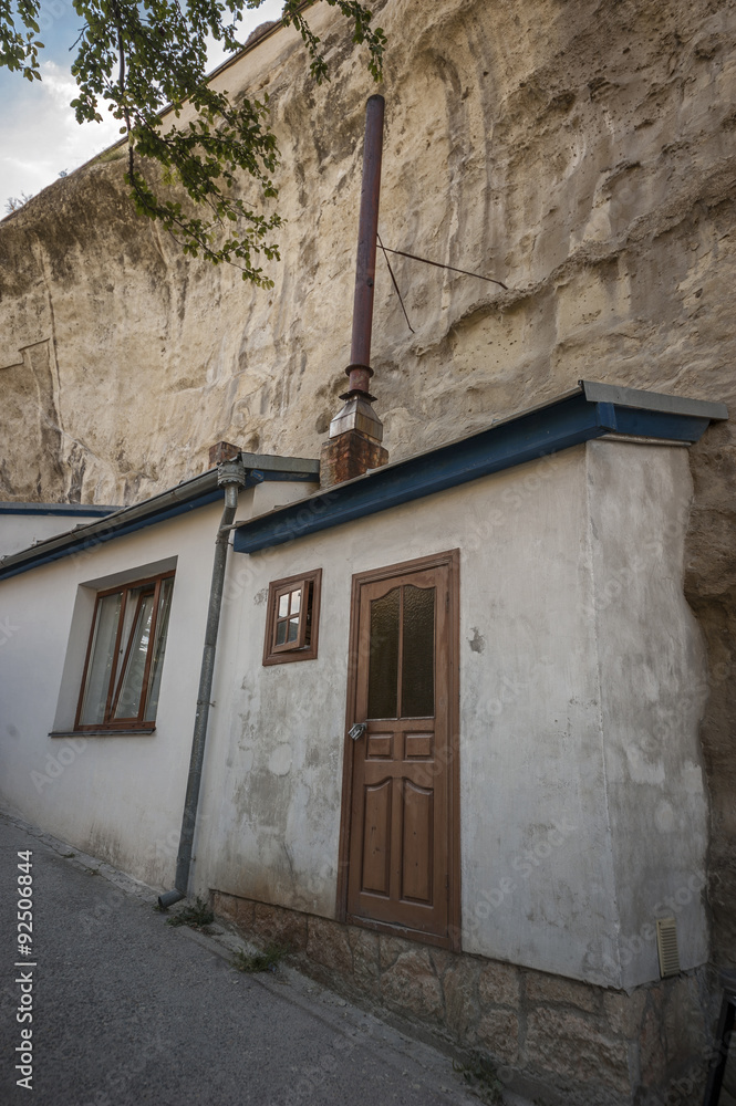 Fototapeta premium Bakhchisaray , Crimea , Russia . Holy - Assumption Orthodox men cave monastery . Carved into the rock cells monks and novices .