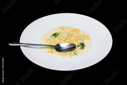 Photo vegetables in creamy sauce on a white plate