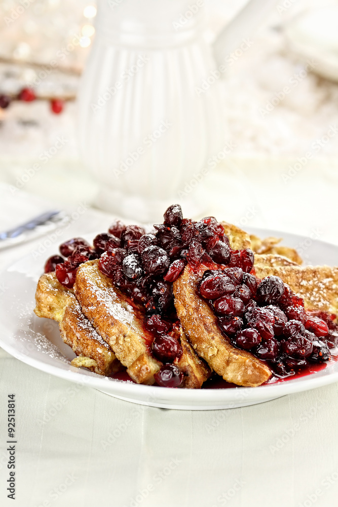 Cranberry Syrup and Powered Sugar over French Toast with selective focus on toast. Cranberry Syrup and Powered Sugar over French Toast with selective focus on toast.