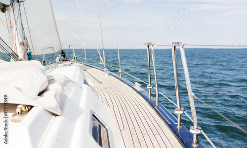close up of sailboat or sailing yacht deck and sea