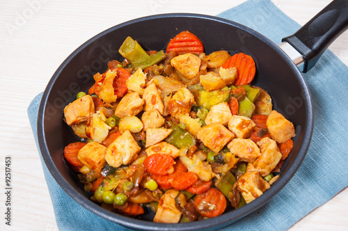 meat stew with mixed vegetables in a frying pan