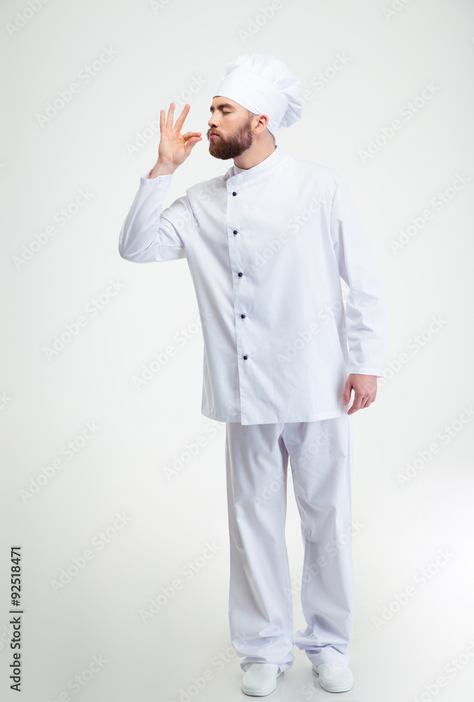 Male chef cook making tasty gesture by kissing fingers Male chef cook making tasty gesture by kissing fingers