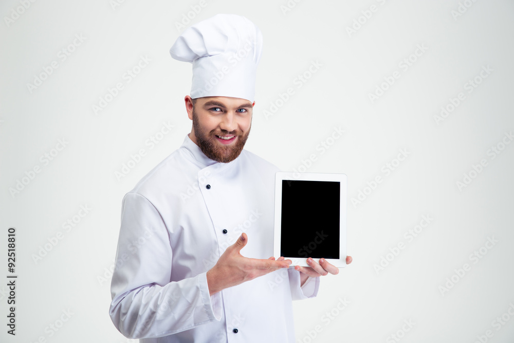 Male chef cook showing blank tablet computer screen Male chef cook showing blank tablet computer screen