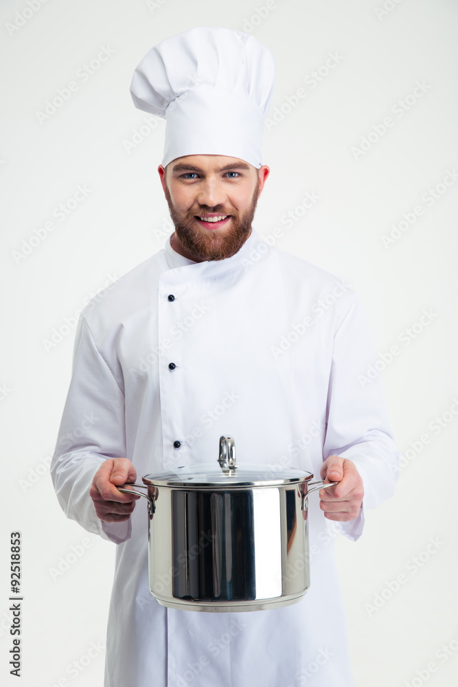 Portrait of a male chef cook holding pan