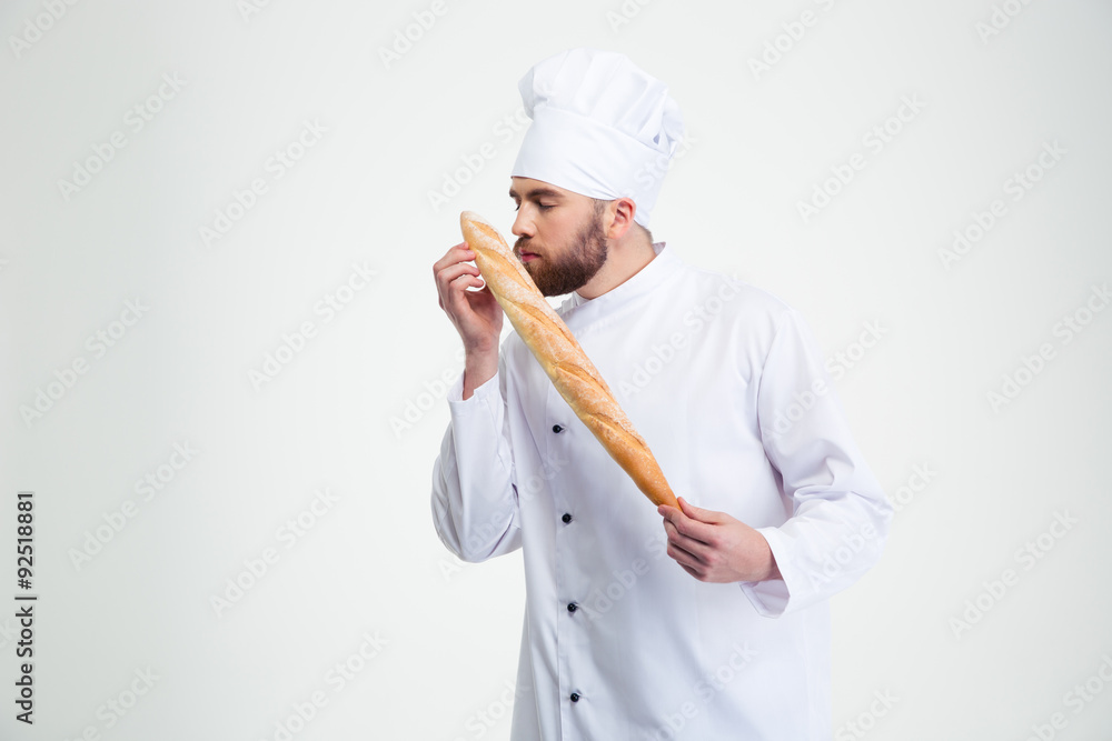 Male chef cook smelling fresh bread