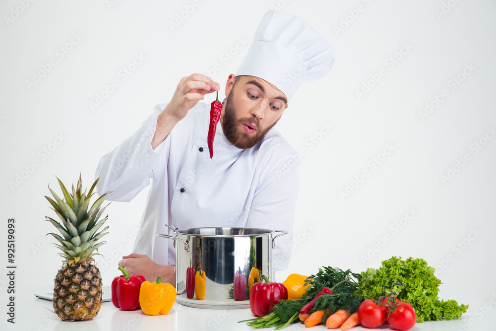 Portrait of a young chef cook preparing soup Portrait of a young chef cook preparing soup
