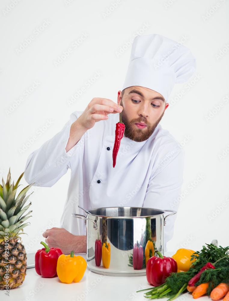 Handsome chef cook preparing food i