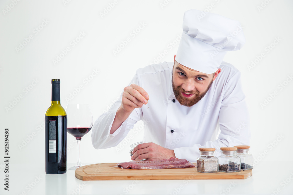 Handsome male chef cook preparing meat Handsome male chef cook preparing meat