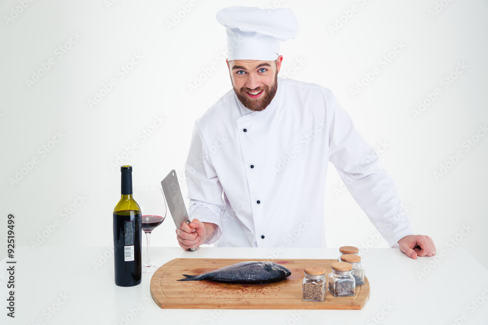 Portrait of a smiling male chef cook preparing fish Portrait of a smiling male chef cook preparing fish