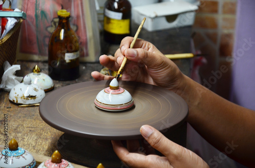 Thai people woking process paint Ceramic Benjarong is traditiona