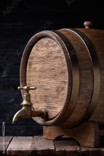 Vintage old oak barrel on wooden table still life
