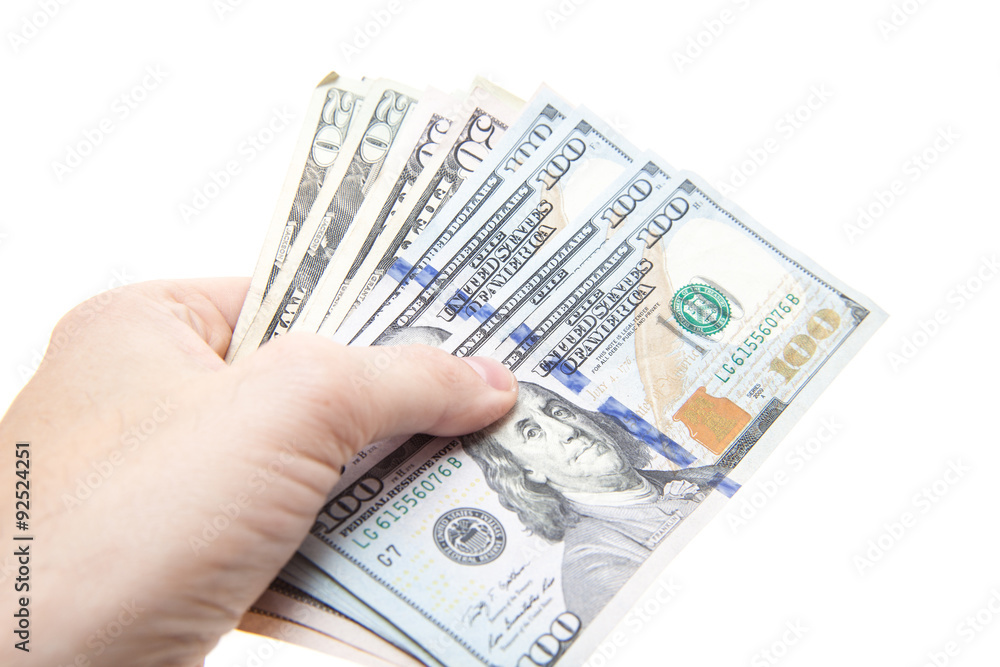Hand holding various dollar notes. All on white background. Hand holding various dollar notes. All on white background.