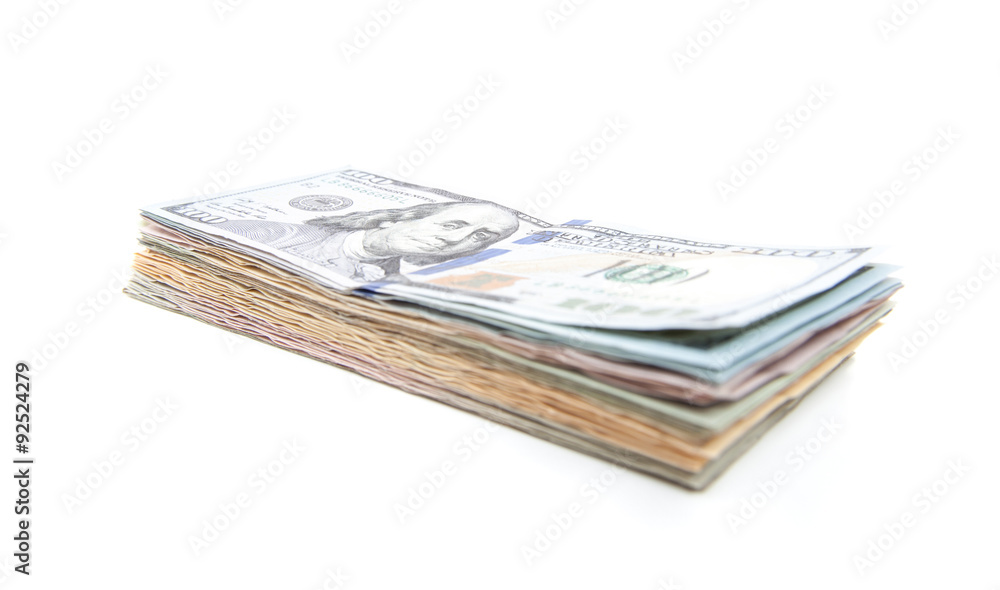 Pile of various dollar notes. All on white background Pile of various dollar notes. All on white background