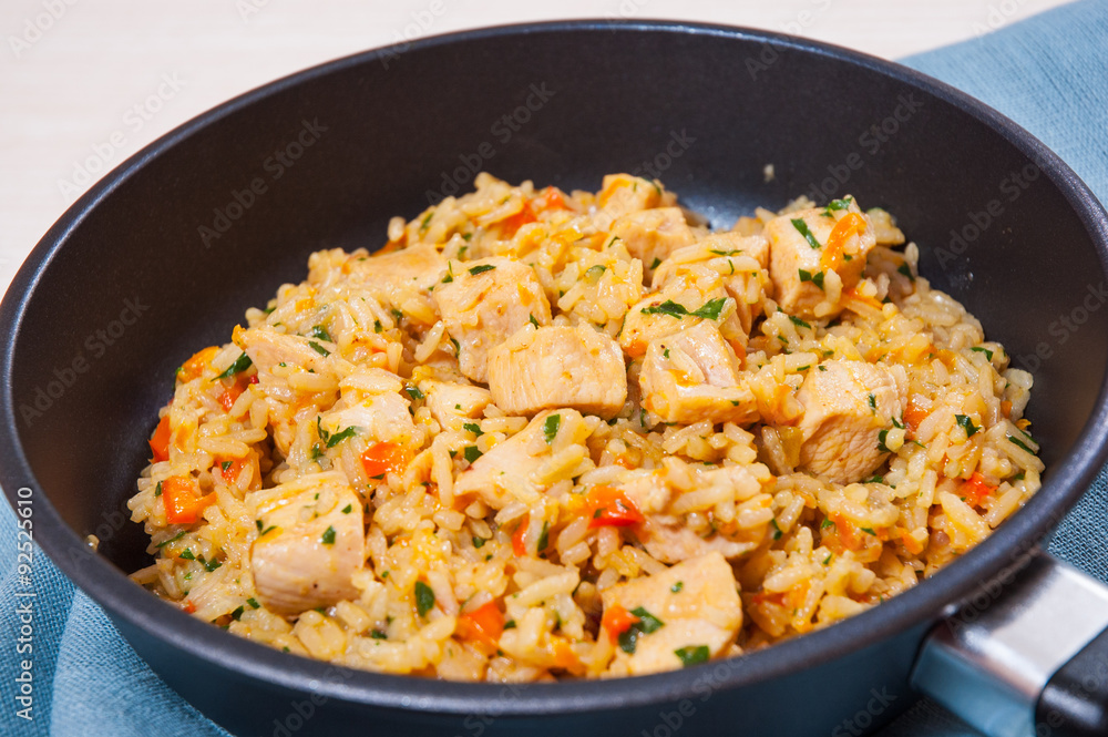Chicken Breast with Rice and vegetables in a frying pan Chicken Breast with Rice and vegetables in a frying pan