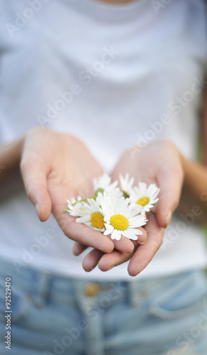 white flowers in the hand